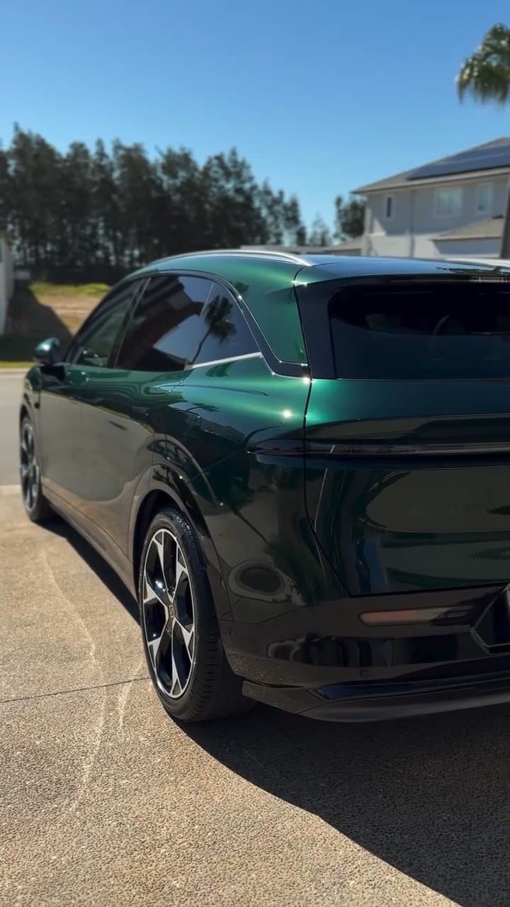 Dark green electric SUV with a deep gloss after ceramic coating