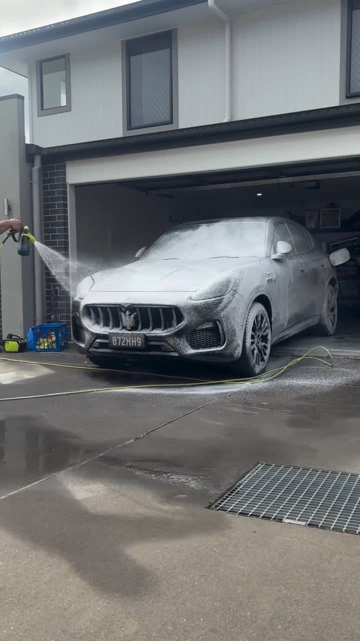 Maserati Grecale covered in snow foam on the owner's driveway